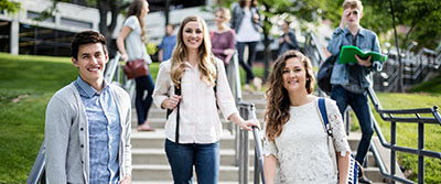 students posing on some stairs outside