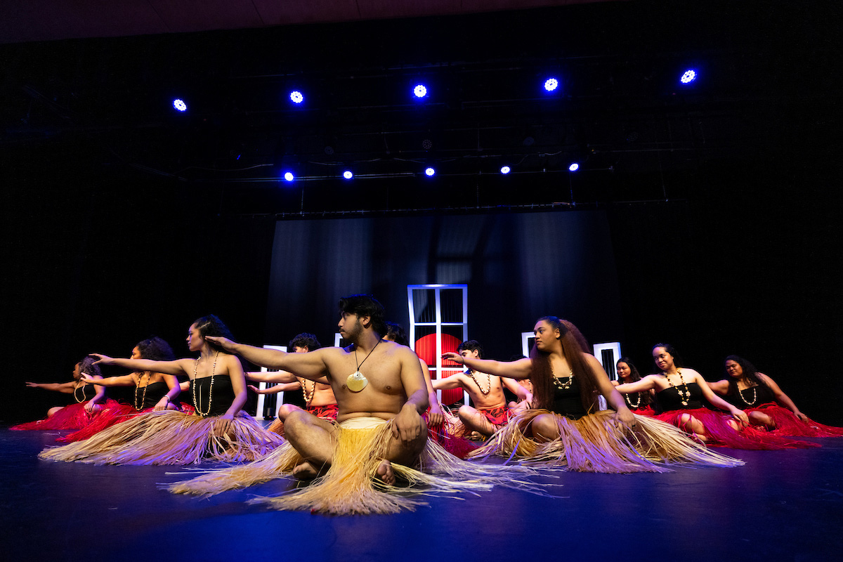 Pacific island dancers on stage.