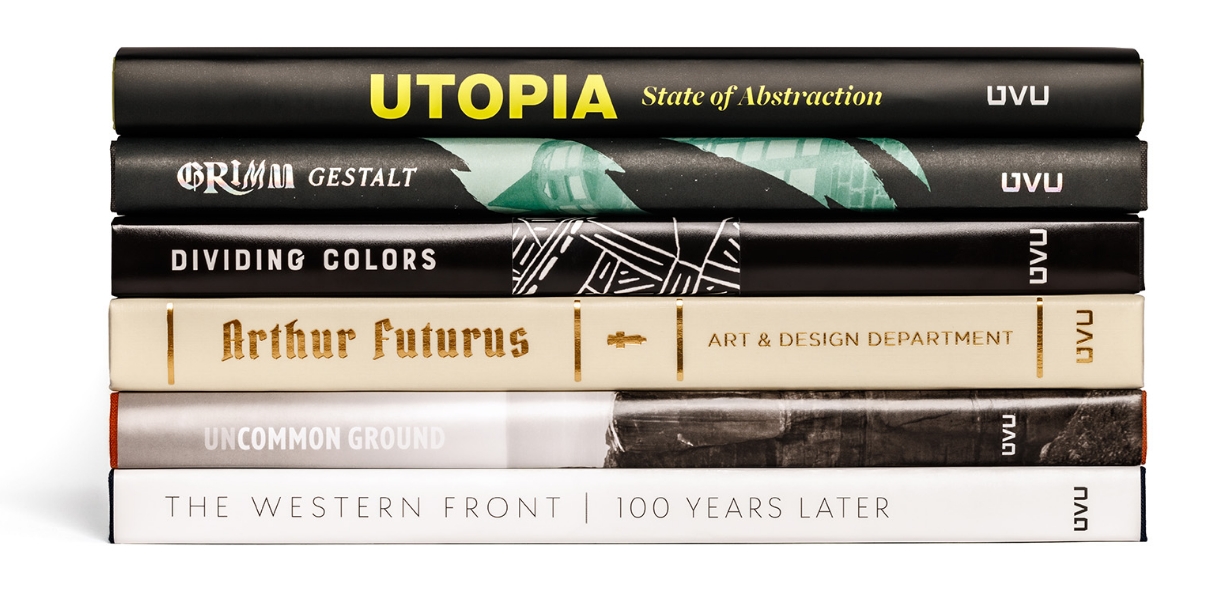 Stack of nine diverse book spines with various designs and titles.              