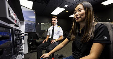 woman using a flight simulator