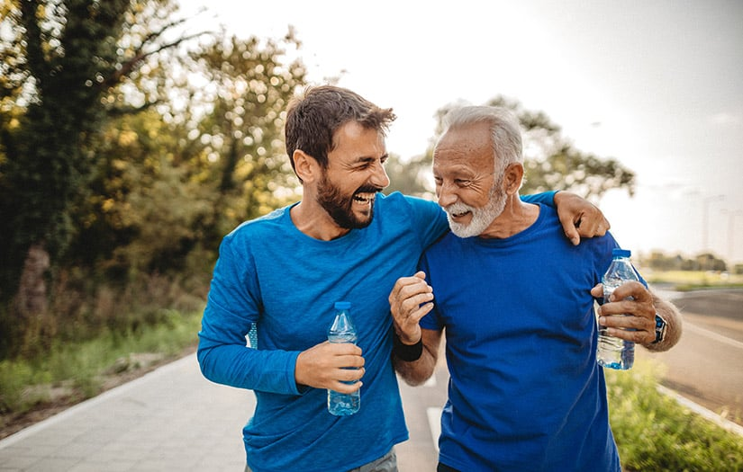 A coach man and older man running together