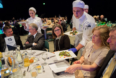 Culinary students serving dinner to guests at the Scholarship Ball