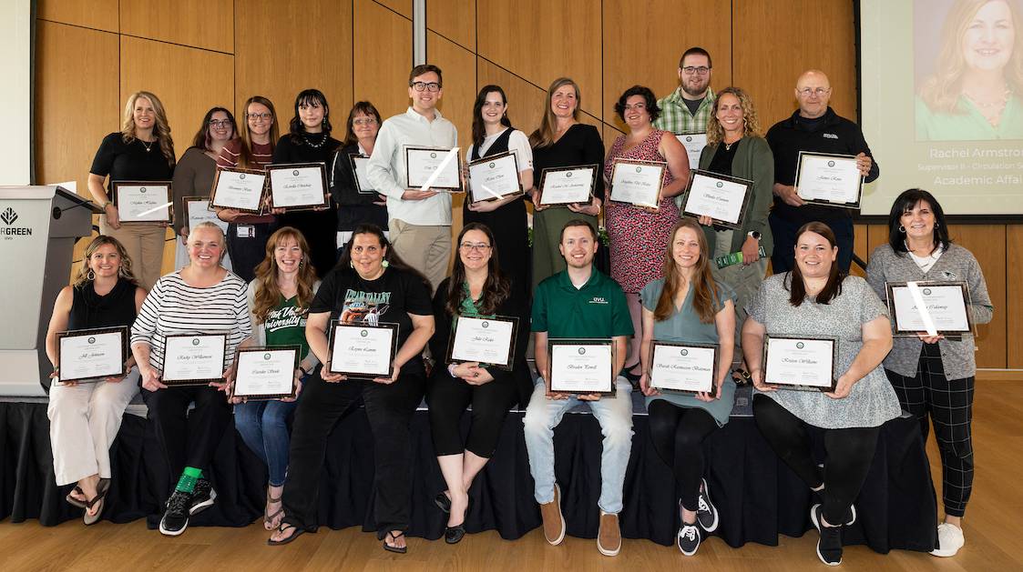 Large group of workshop participants with their certificates.
