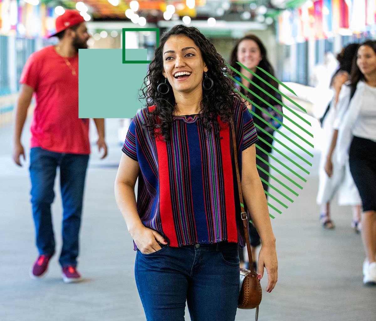 Woman walking in busy hallway. The image is embellished with colorful graphic elements.