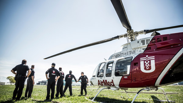 Helicopter with people standing outside