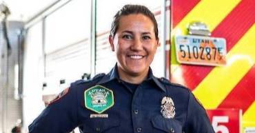 officer standing in front of a truck.