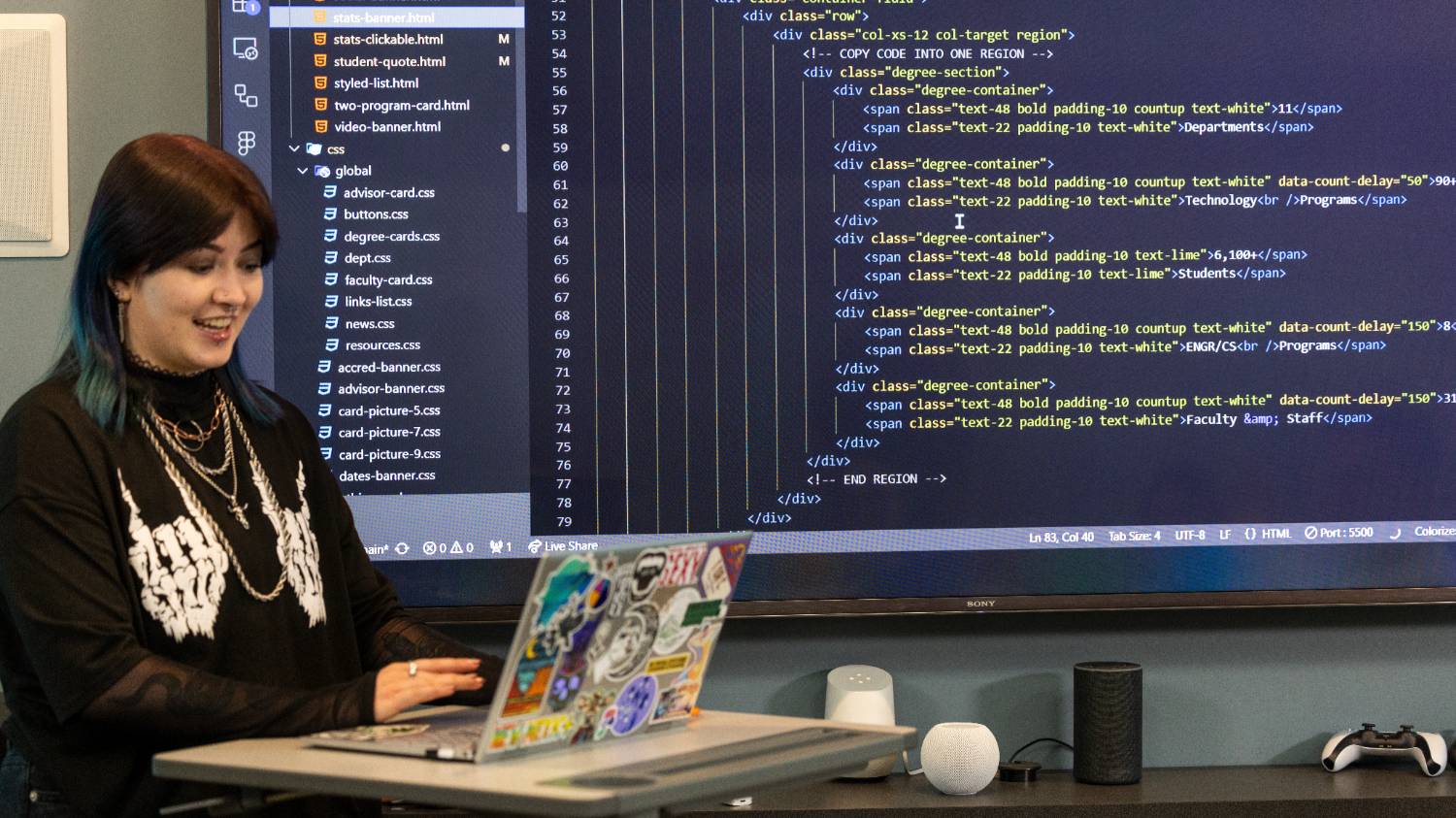computer science student presenting code infront of class