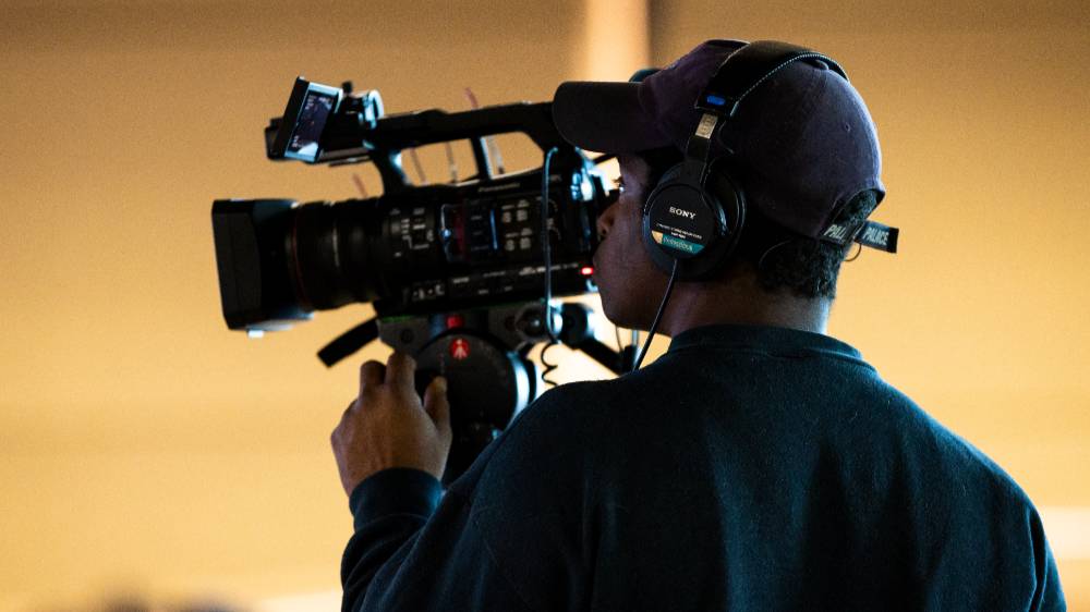 student filming event