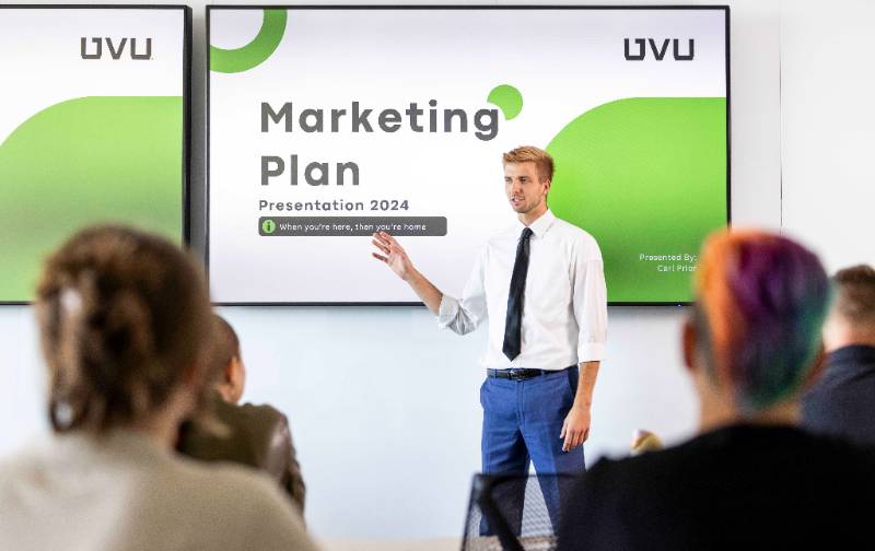 student presending marketing plan to class