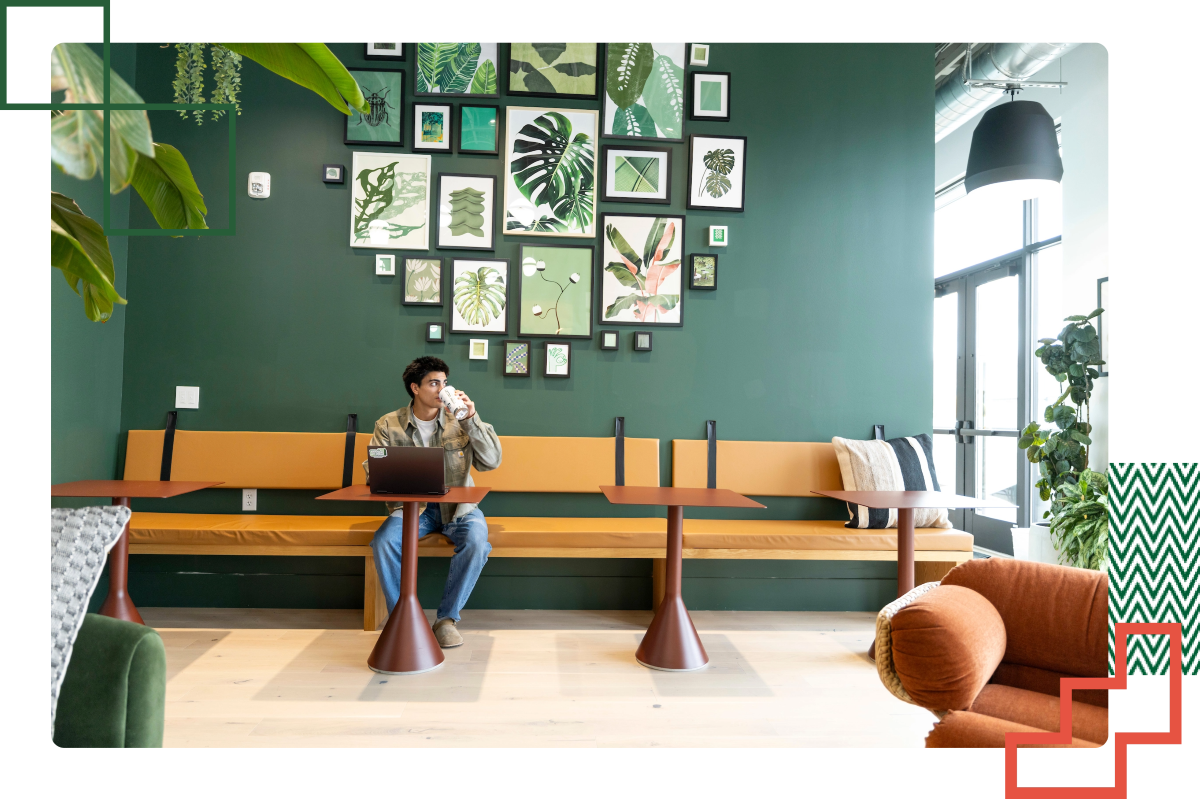 student seated at a table with a laptop in front of them