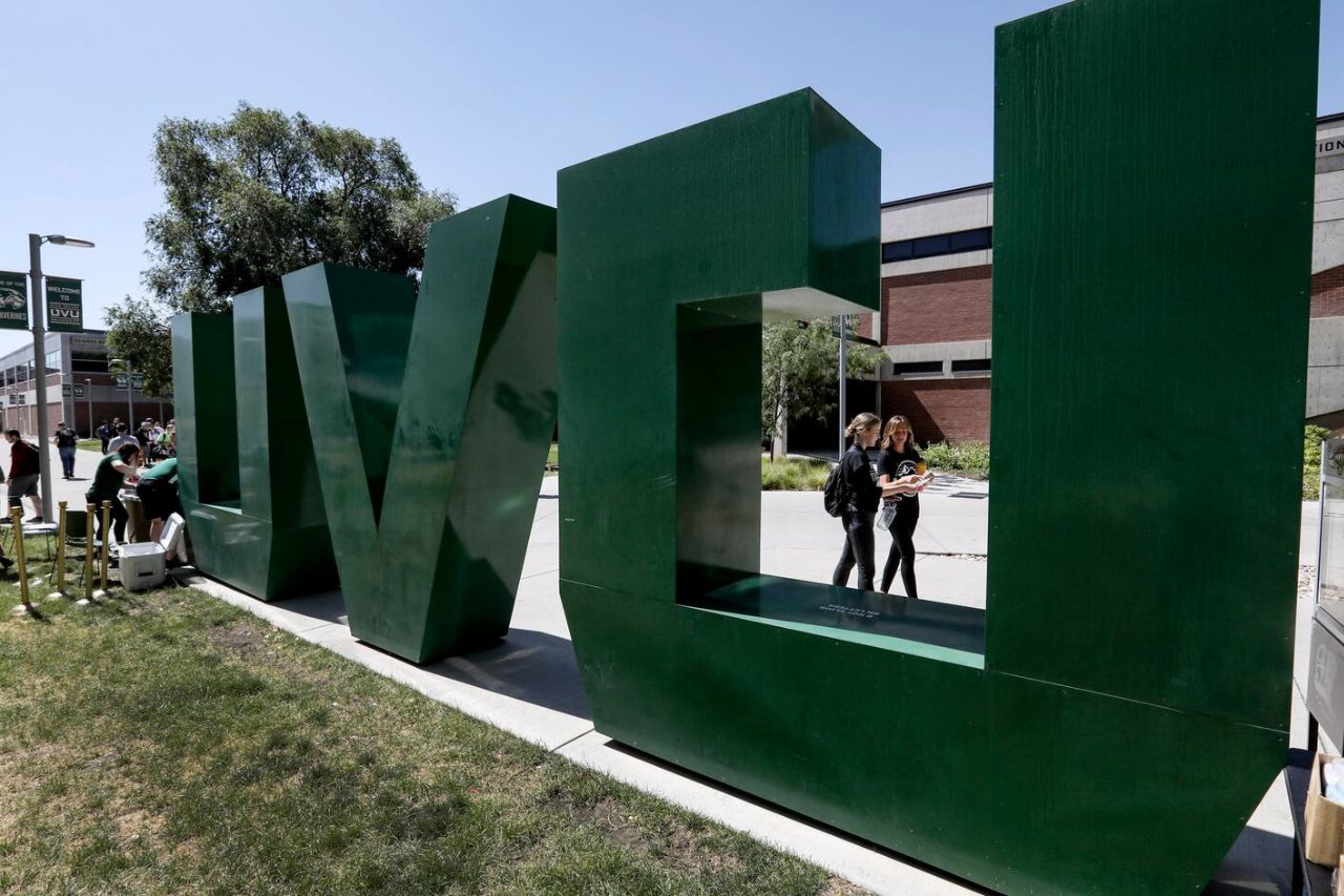 UVU Sign with students