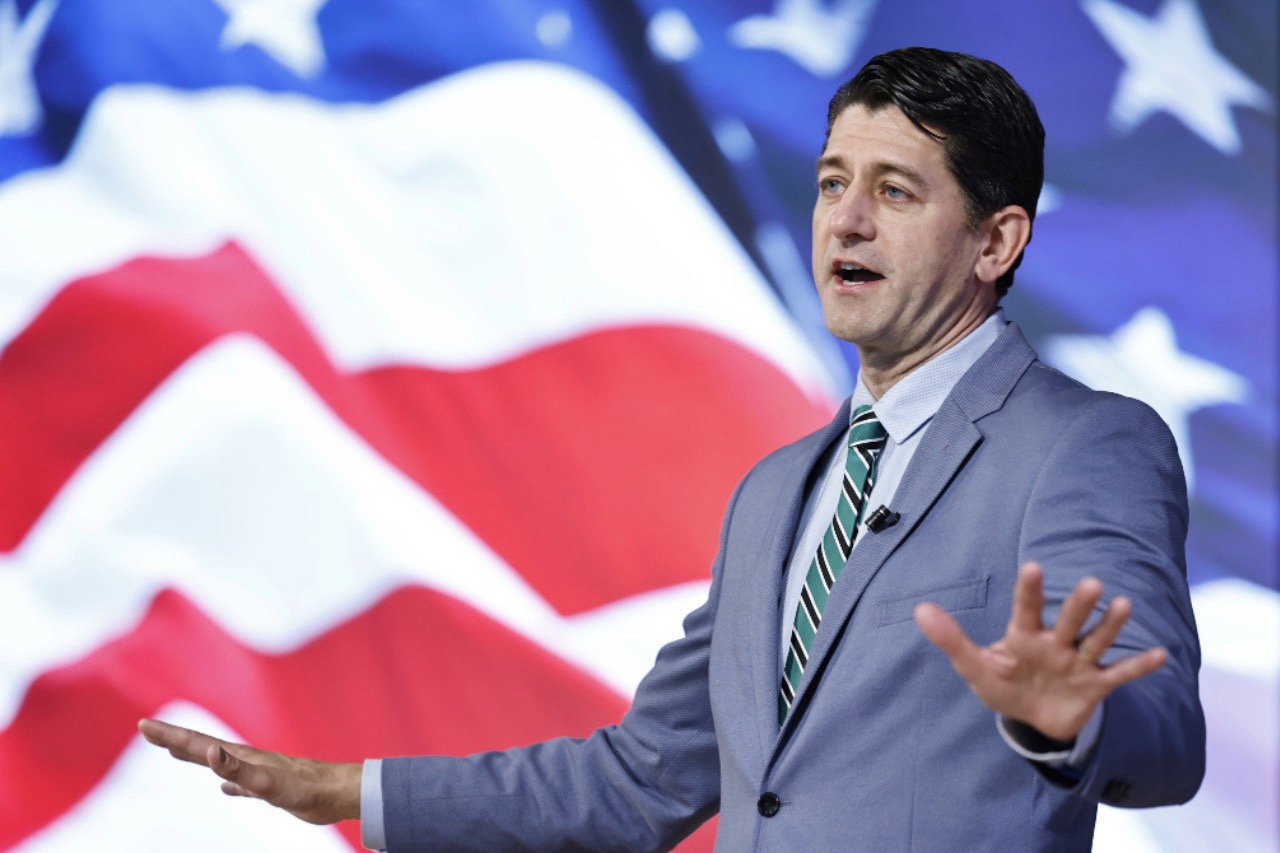 Paul Ryan at UVU with American flag in the background