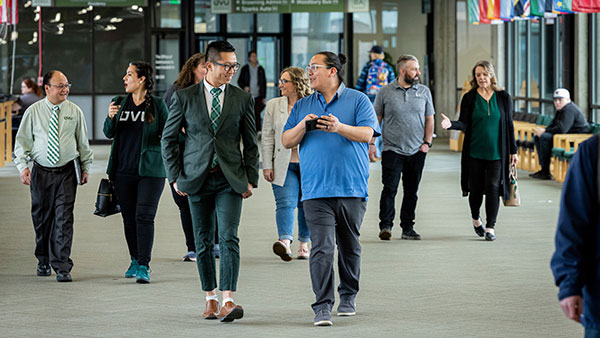 Image of people walking down a hall