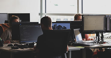 man working on a computer in an office