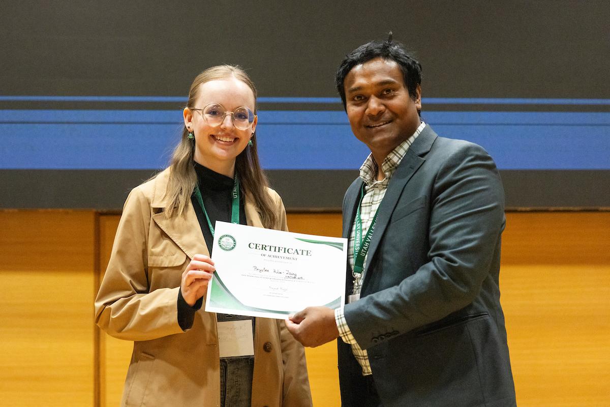 UVU professor 细哔叽Sajal posing with award recipient