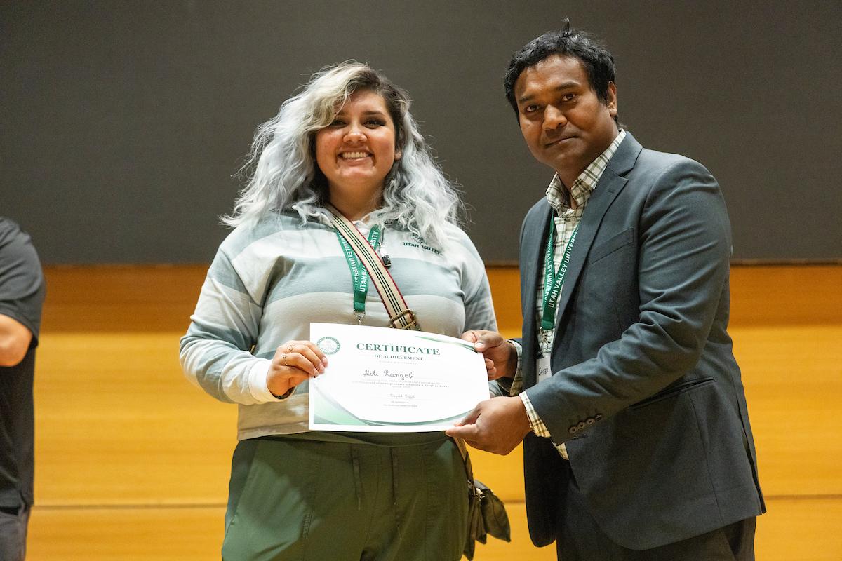 UVU professor 细哔叽Sajal posing with award recipient