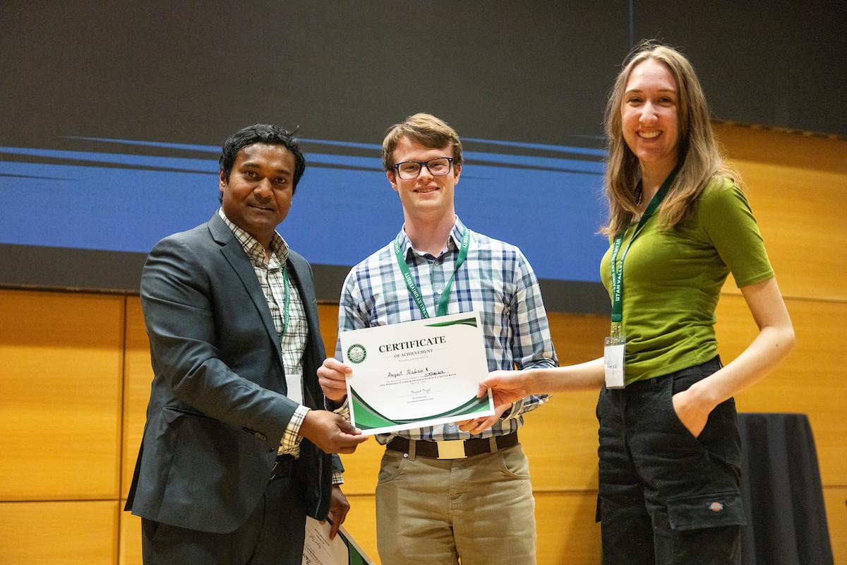 UVU professor 细哔叽Sajal posing with award recipient