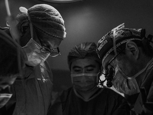 Doctors doing operations on a patient