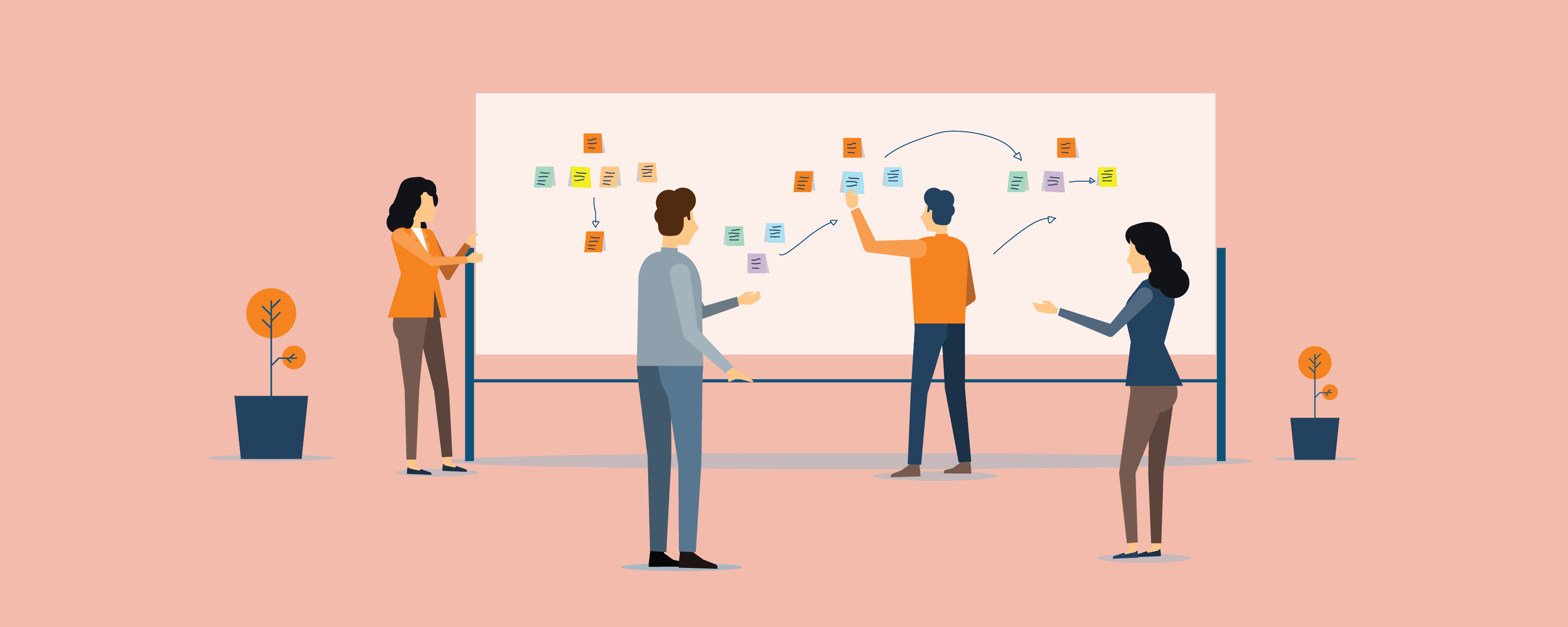 Figures at whiteboard covered in Post-It notes
