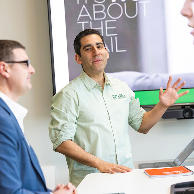 Man presenting to people in a UVU conference room
