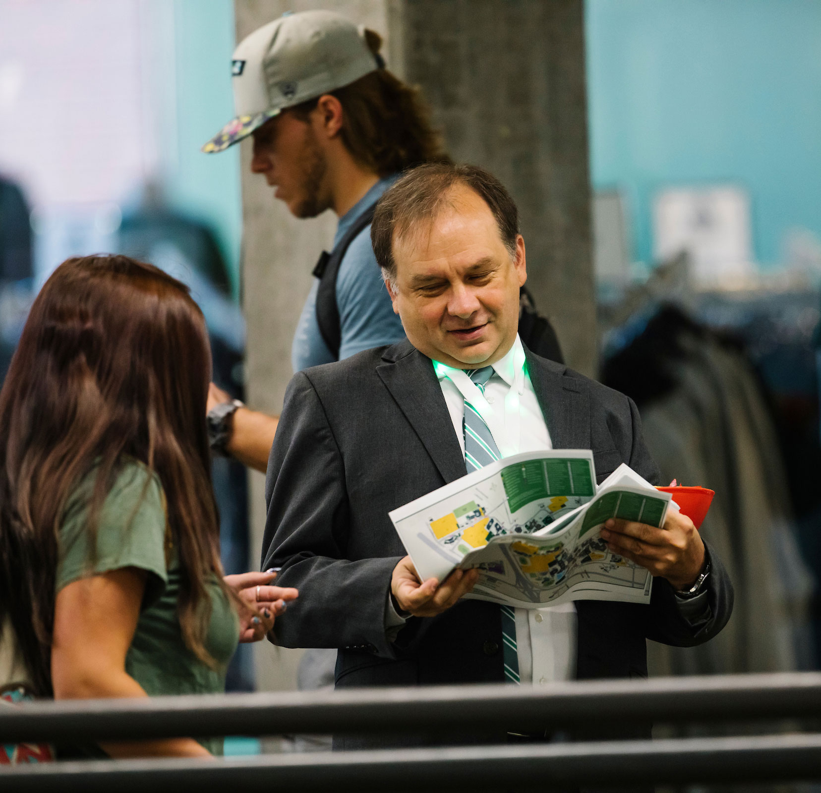2 people looking at the UVU campus map