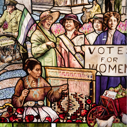 Roots of Knowledge panel depicting women protesting.