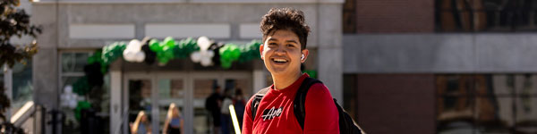 A member of TRIO SSS smiling on campus at UVU